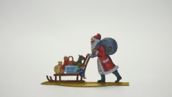 Weihnachtsmann Schlitten schiebend, beidseitig graviert